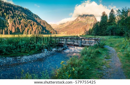 Sunny summer landscape on the Obersee lake. Colorful morning view of Swiss Alps, Nafels village location, Switzerland, Europe. Artistic style post processed photo.