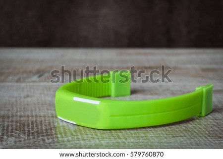 fitness bracelet on a wooden background. sport. fitness. 