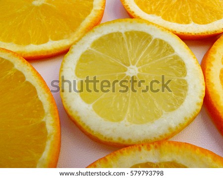 Healthy food flat lay. Fresh bright fruits background. Lemon macro photography with oranges on white background