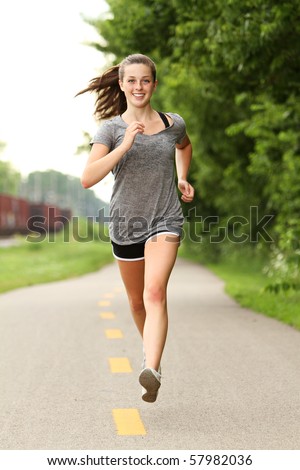 Teenager out for a jog Royalty-Free Stock Photo #57982036