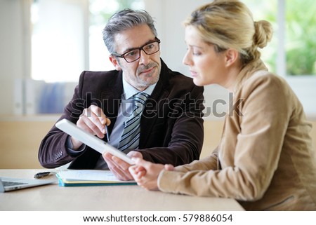 Woman meeting notary for advice Royalty-Free Stock Photo #579886054