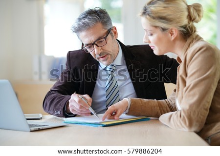 Woman meeting notary for advice Royalty-Free Stock Photo #579886204