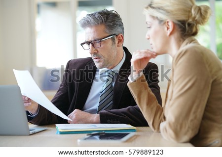 Woman meeting notary for advice Royalty-Free Stock Photo #579889123