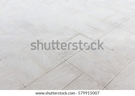 Artificial stone tile floor with grid line and space in perspective view for background. Exterior flooring cover by square shape of tile made from artificial stone with perspective straight grid line.
