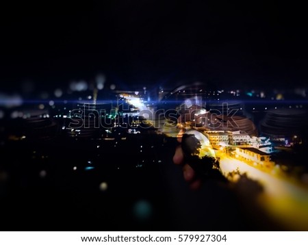 Double exposure photo female hand opening the door to success concept with business, and rows of coins for financial and banking, view of night cityscape background, leadership, achievement