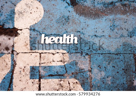Abstract health sign on old pavement background with copy space. Health problem concept. Top view
