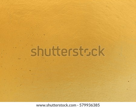 Gold concrete wall texture for background