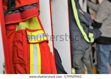 Firefighting clothing, in the background a fireman