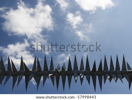 metal fence against blue sky
