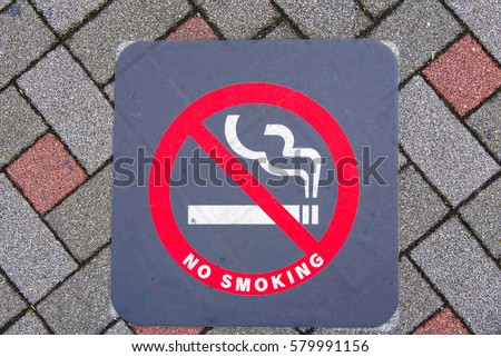 Close up of no smoking sign on the ground in Japan.
