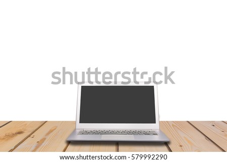 Laptop with blank screen on wooden table with white background, can used for display or montage your products