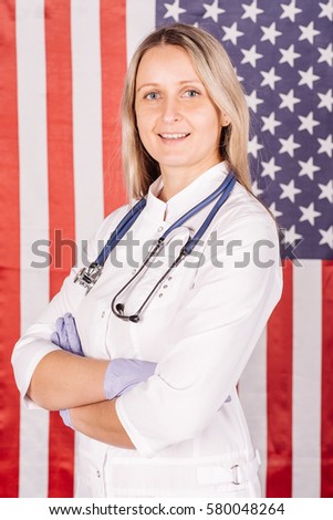 female doctor with stethoscope on a usa flag background