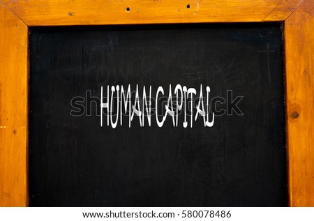 HUMAN CAPITAL -  Hand writing word to represent the meaning of Business word as concept.