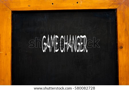 GAME CHANGER -  Hand writing word to represent the meaning of Business word as concept.