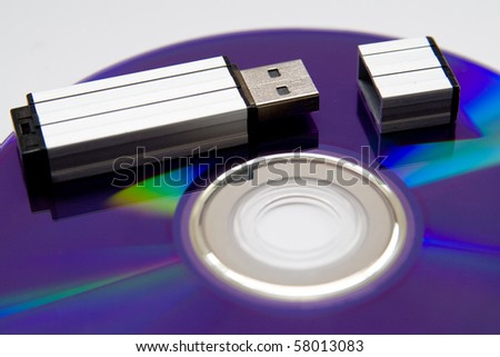 Flash card lying on a disk on a grey background