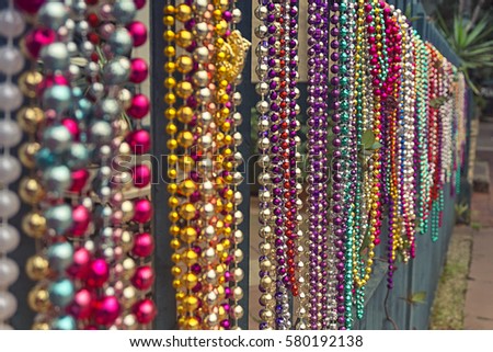Set of colourful beads on a fence for Mardi Gras,New Orleans, Louisiana, USA.
Carnival time.
