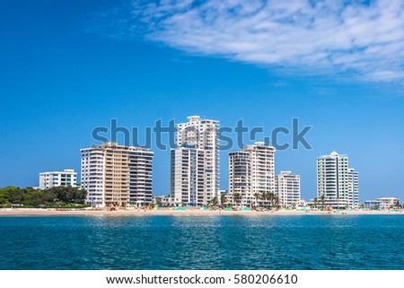 White buildings on the beach.