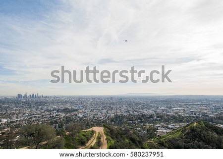 Los Angeles Griffith Park and Downtown LA skyline in the distance.  