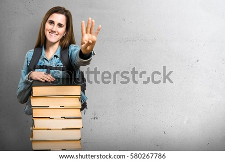 Teen student girl with a lot of books and counting four