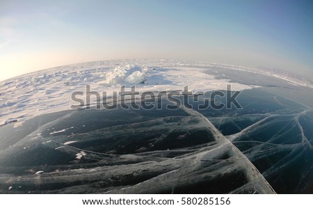 Picture taken by the action camera. Fish-eye lens. Panorama of the frozen ice of Lake Baikal
Photo toned