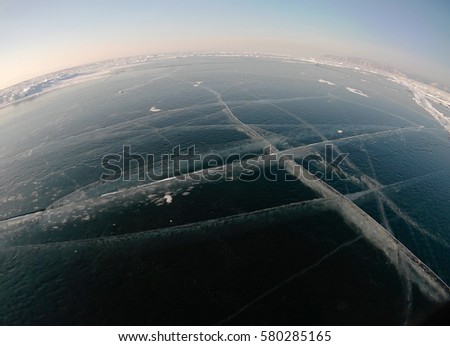 Picture taken by the action camera. Fish-eye lens. Panorama of the frozen ice of Lake Baikal
Photo toned