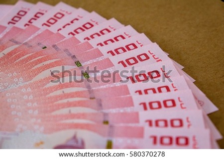 Abstract soft focus money on wooden table concept saving money