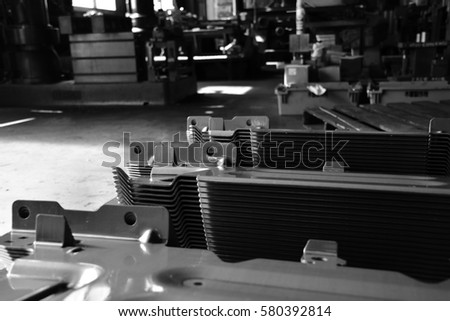 Car parts Produced by Accurate Sheet Metal Stamping Tool Die. Black-and-white photo.