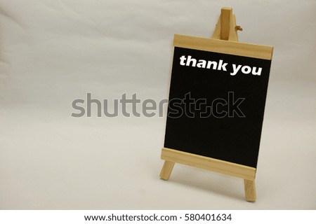 "Thank You" written on blackboard isolated over white background