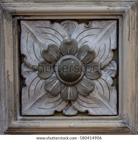 Stucco temple wall flower