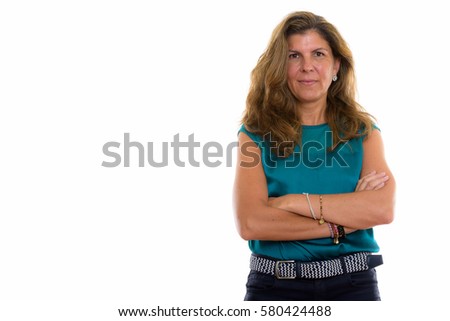 Studio shot of mature beautiful woman with arms crossed