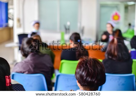 Background blur of patients waiting for treatment in the hospital