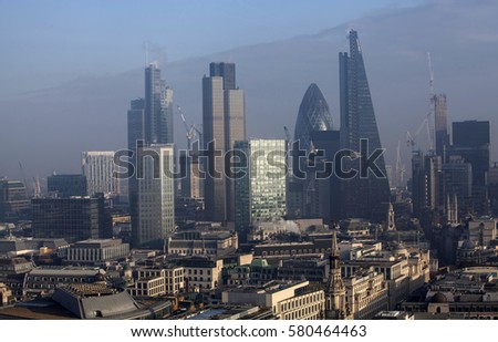 City of London, business and banking aria. Rooftop view over London on a foggy day from St Paul's cathedral, UK