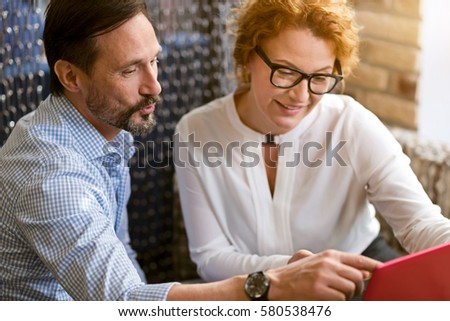 Involved delighted colleagues working in the cafe Royalty-Free Stock Photo #580538476