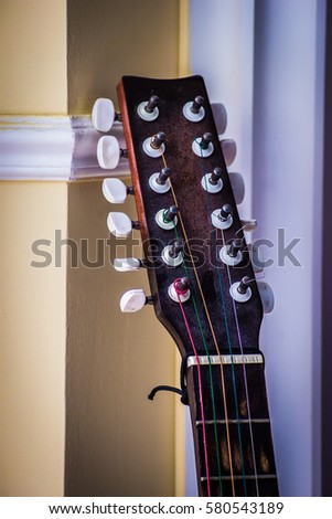Guitar headstock on wall background