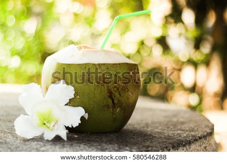 Coconut with flowers Natural background bokeh bright