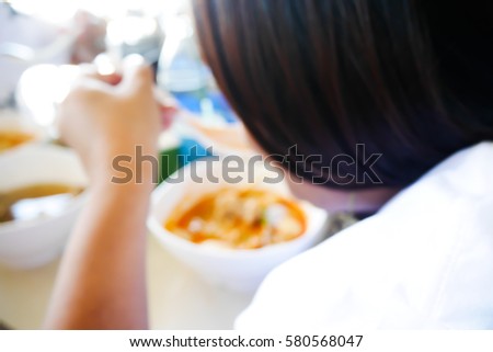 Picture blurred  for background abstract and can be illustration to article of woman eat noodle