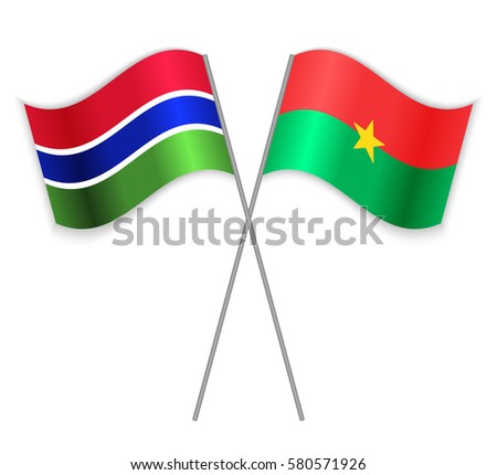 Gambian and Burkinabe crossed flags. Gambia combined with Burkina Faso isolated on white. Language learning, international business or travel concept.
