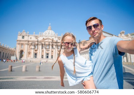 Happy family background St. Peter's Basilica church in Vatican city taking selfie
