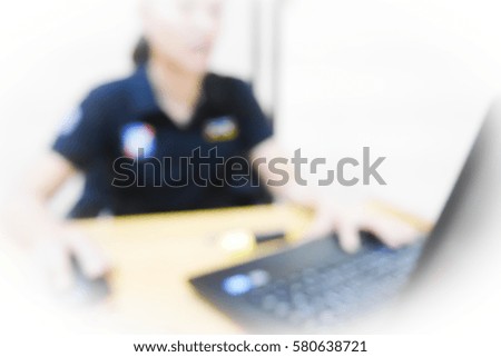 Picture blurred  for background abstract and can be illustration to article of officer working computer