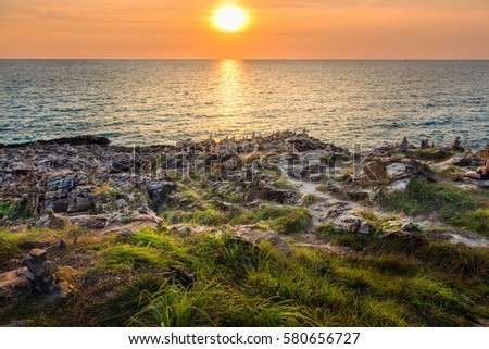 Cliff Sunset , Beautiful scenic view on stones and caves in late autumn sunset light , Beautiful summer sunset over the sea