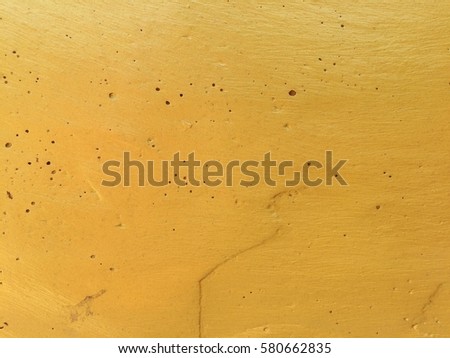 Gold concrete wall texture for background design