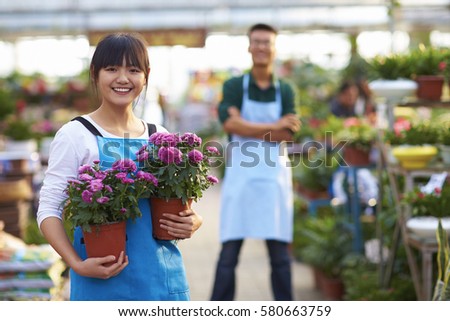 Picture of Two Young Chinese Florist Working in the Shop