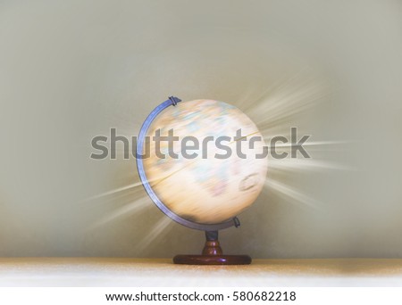 Glowing light filtered on Spinning globe model, world environmental and travel concept