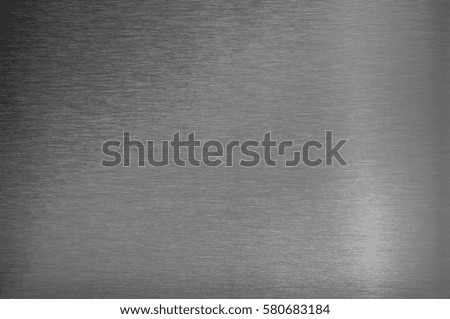 Black and white converted texture of stainless steel, blank metal sheet, background closeup.