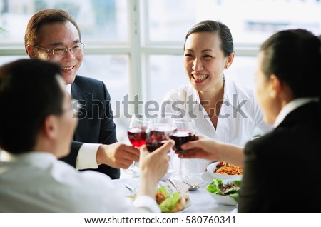 Executives toasting with wine