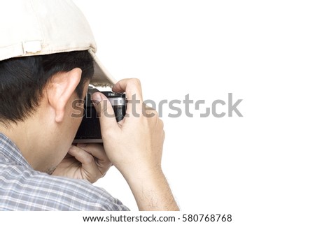 Man holding film camera ready to take photo over white background