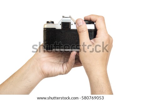Man holding film camera ready to take photo over white background