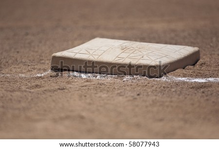 Close up shot of first base on a baseball field