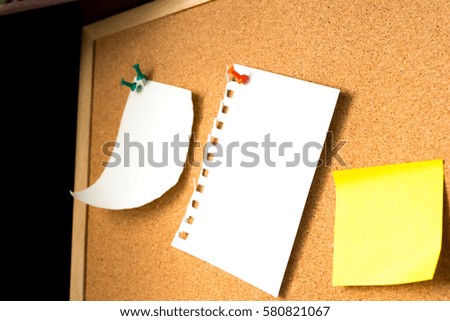 Abstract Empty paper sheet with magnet on wooden board. paper note background with blank texture blackboard with wooden background. education and symbol as concept.