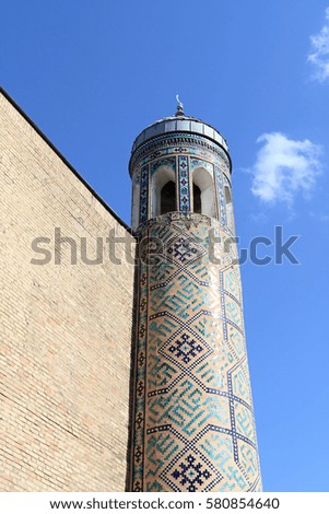 Fragment of minaret on the sky background